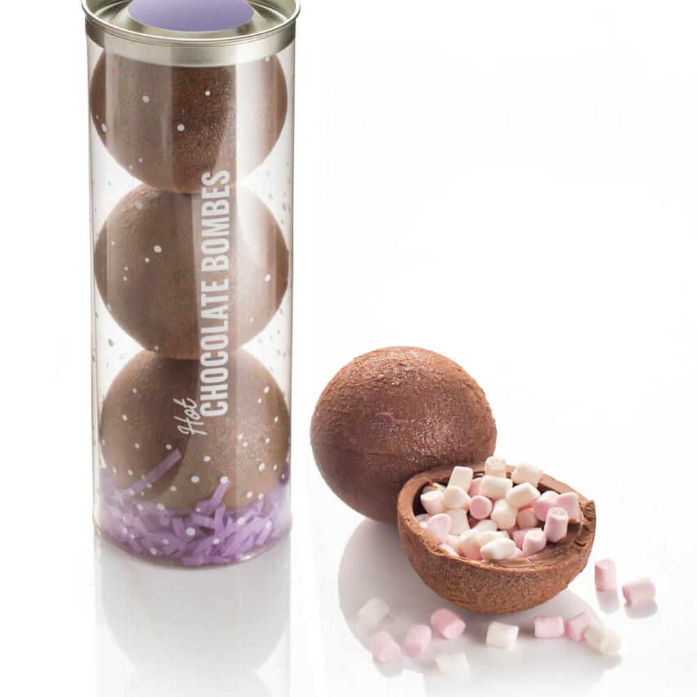 Hot Chocolate Bombes made with real Belgian milk chocolate packed with mini-marshmallows inside, dusted in cocoa powder